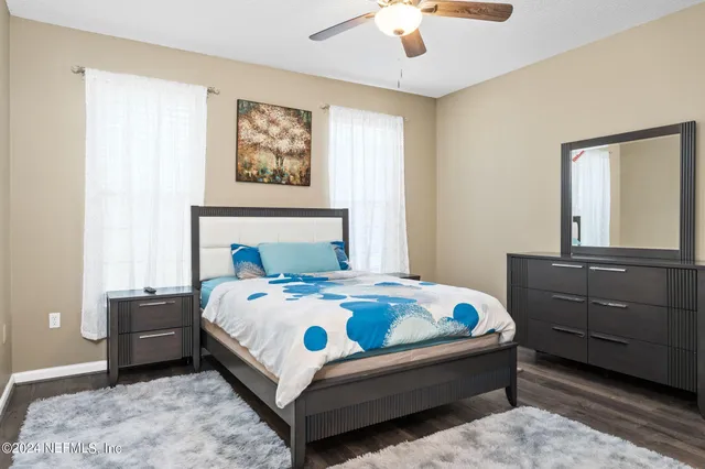 a bedroom with a bed and a dresser