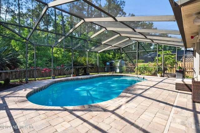 a view of a swimming pool with a patio