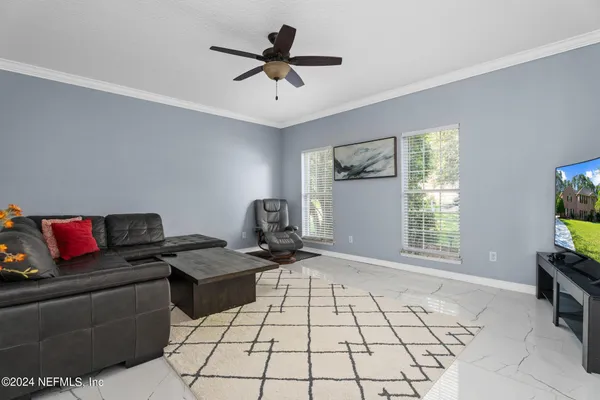a living room with furniture and a window