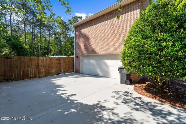 a side view of a house with a yard