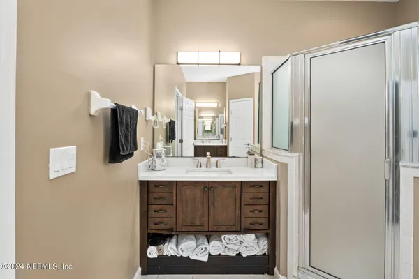a bathroom with a sink double vanity and a mirror