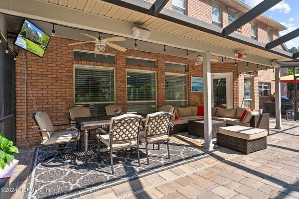 a outdoor space with patio furniture and potted plants