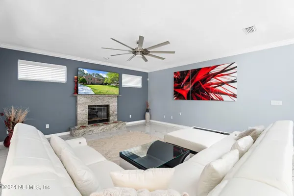 a living room with furniture and a fireplace