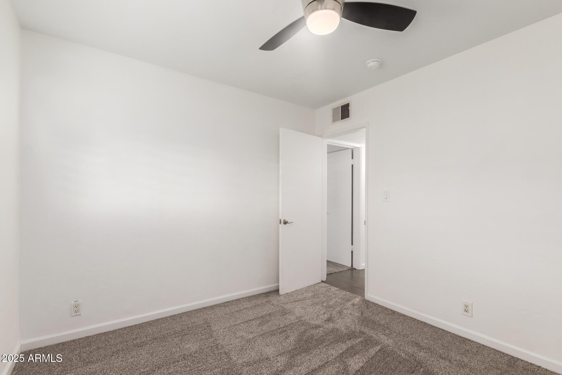 8912 North 17th Avenue Phoenix, AZ 85021 - Photo 23 of 33 an empty room with closet and view of hallway