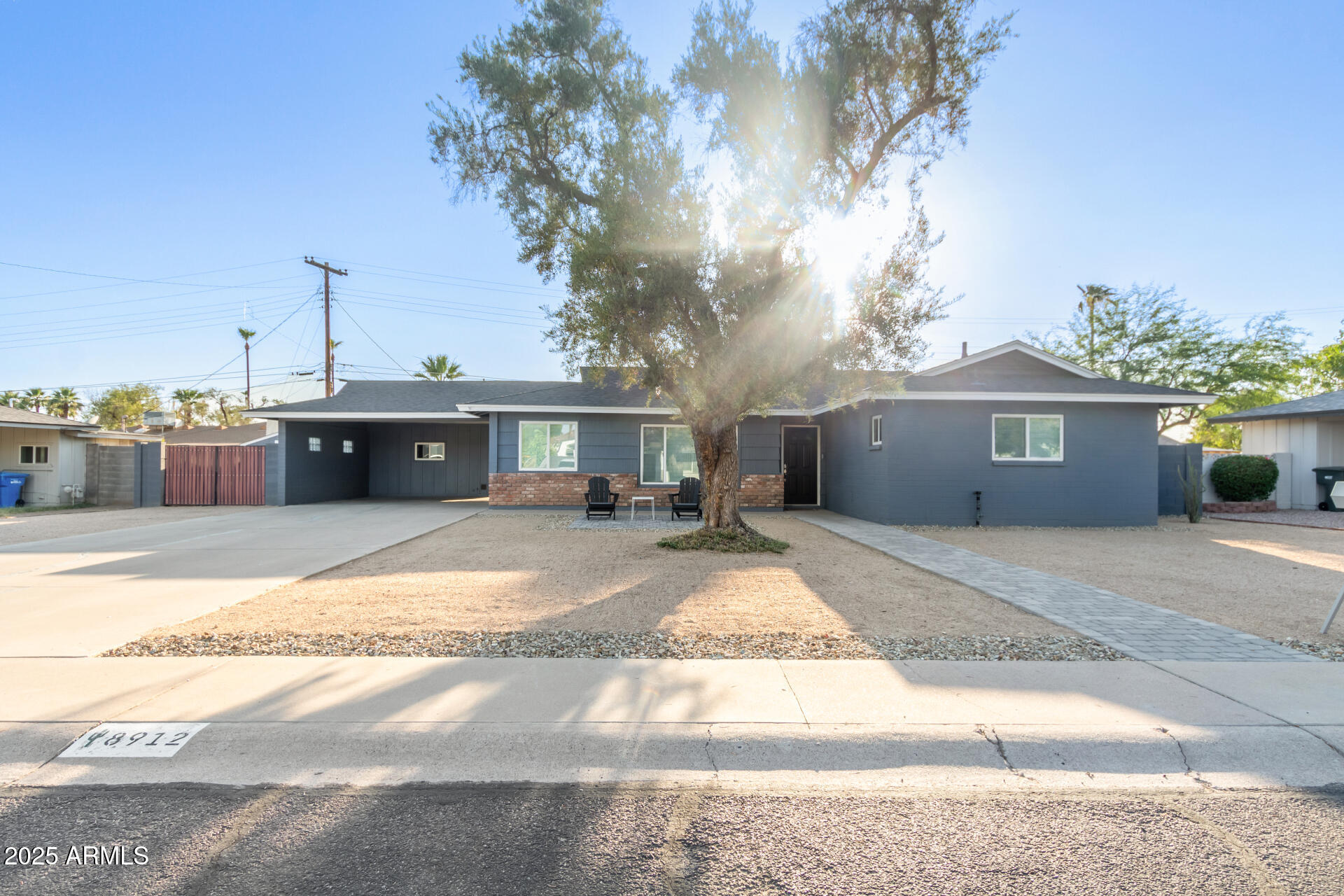 8912 North 17th Avenue Phoenix, AZ 85021 - Photo 5 of 33 a view of a house with a yard and a large tree