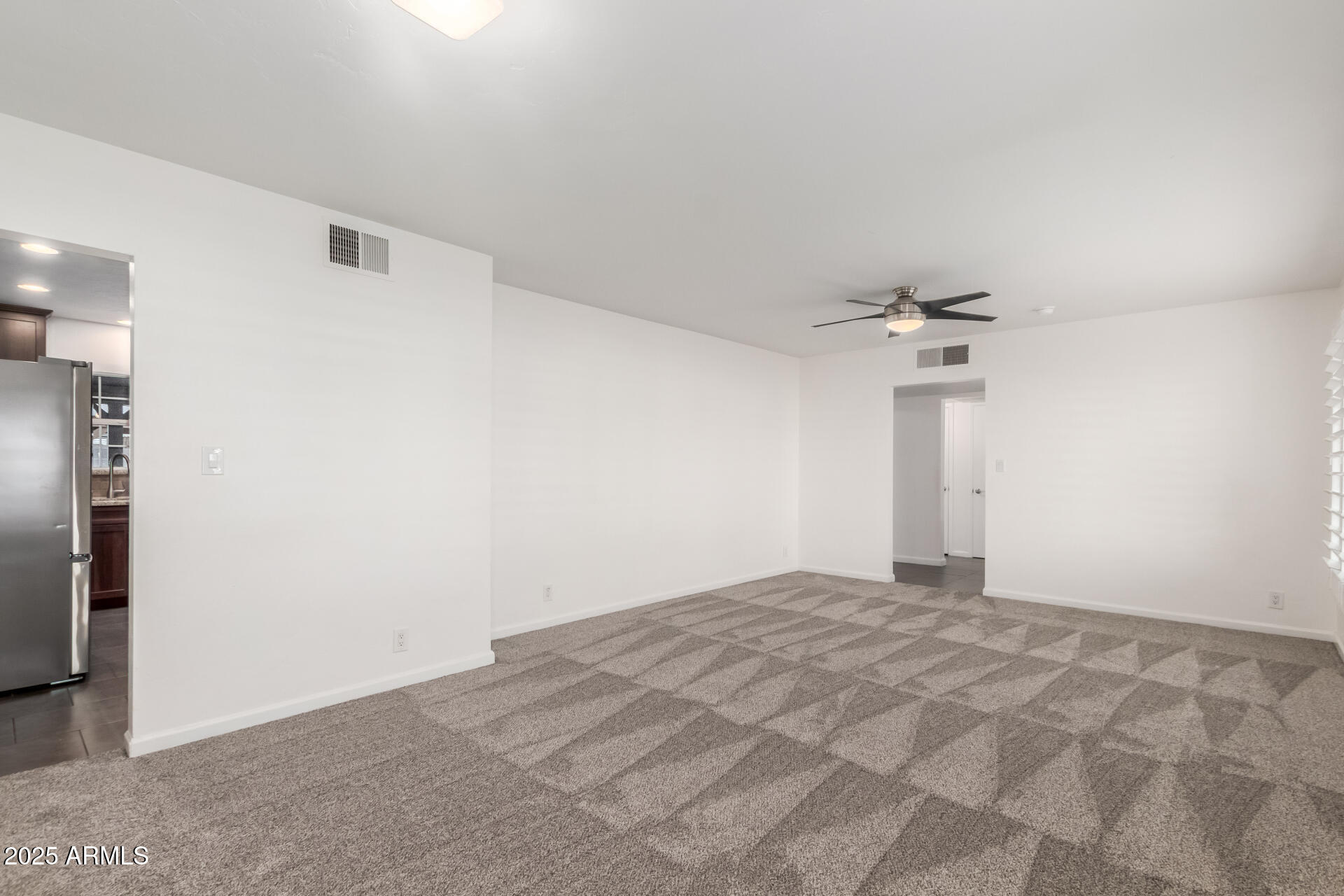 8912 North 17th Avenue Phoenix, AZ 85021 - Photo 10 of 33 a view of empty room with a ceiling fan