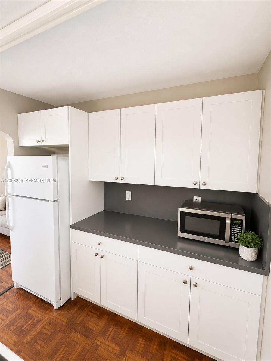 375 Southwest 19th Avenue, Unit 4 Miami, FL 33135 - Photo 19 of 30 a kitchen with appliances and cabinets