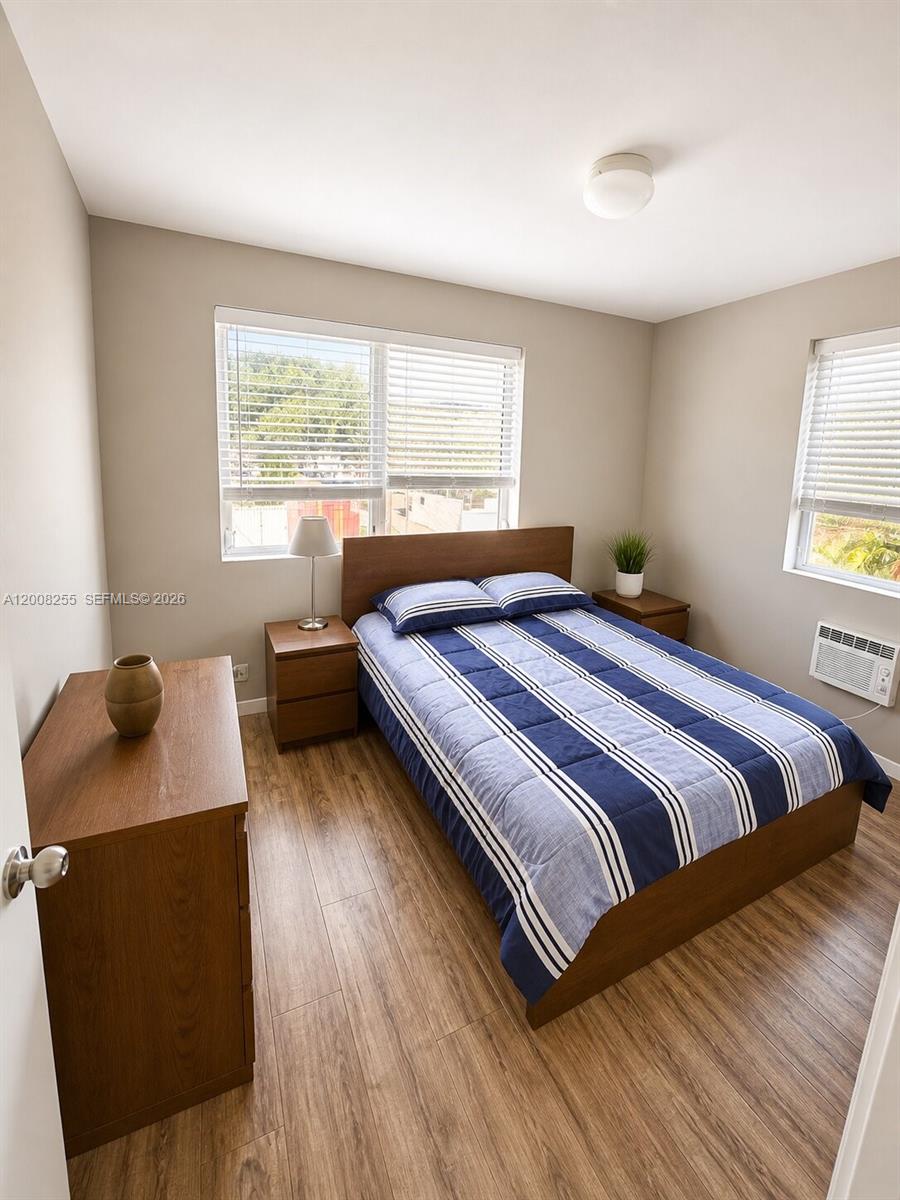 375 Southwest 19th Avenue, Unit 4 Miami, FL 33135 - Photo 23 of 30 a bedroom with a bed and window