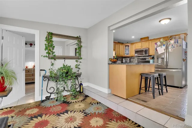 a living room with furniture and a table