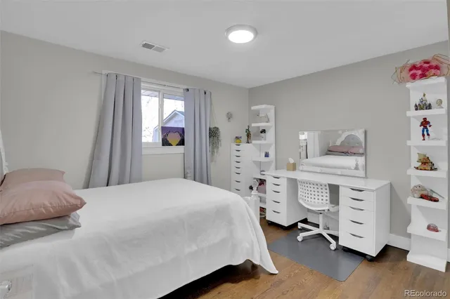 a bedroom with a bed and a dresser