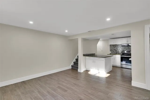 a view of kitchen with stainless steel appliances refrigerator oven and stove