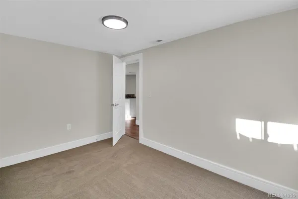 an empty room with a empty space and window