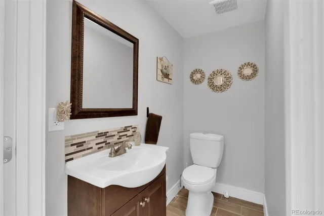 a backyard of a house with outdoor seating