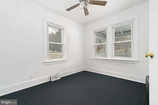 an empty room with wooden floor