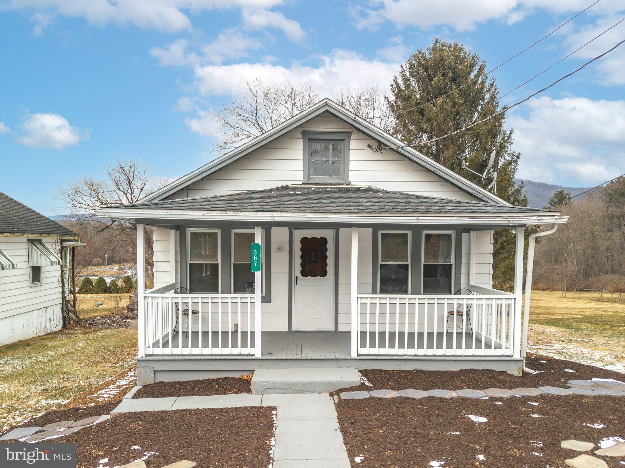 367 Old State Road Gardners, PA 17324 - Photo 2 of 24 a view of a house with a small yard and wooden fence