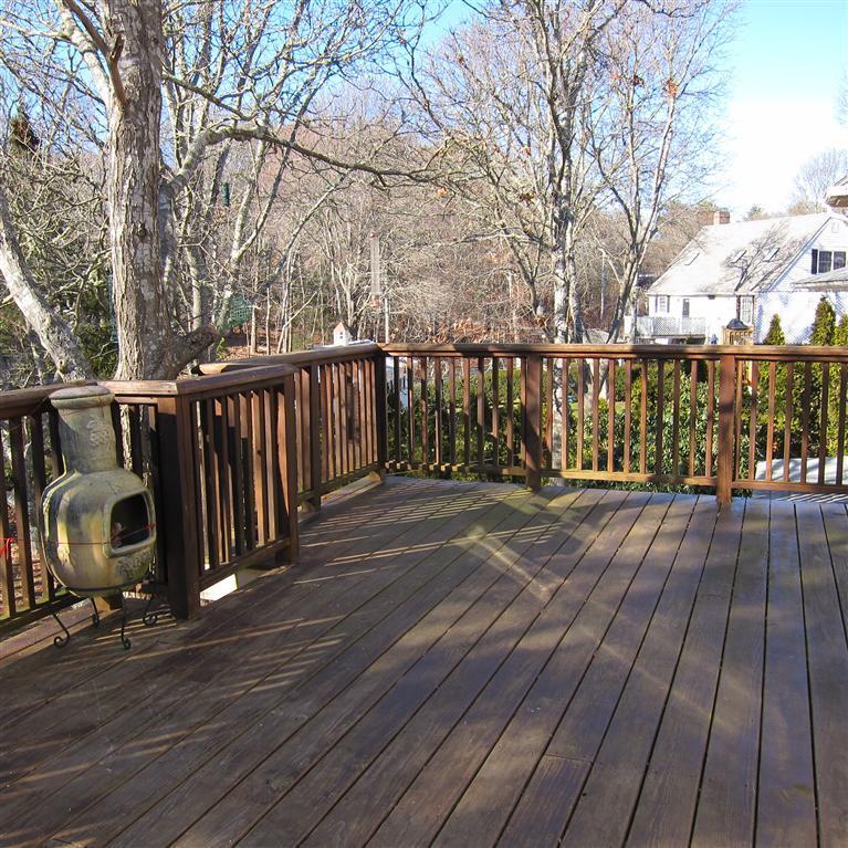 7 Oak Ridge Road East Falmouth, MA 02536 - Photo 11 of 13 a deck view with wooden floor and fence next to a yard