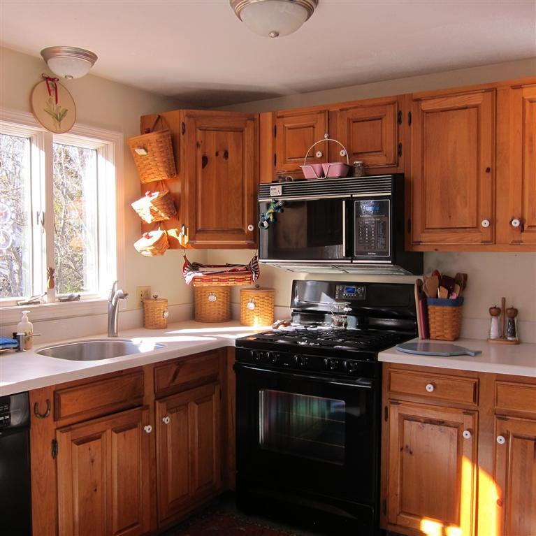 7 Oak Ridge Road East Falmouth, MA 02536 - Photo 3 of 13 a kitchen with stainless steel appliances a stove sink and microwave