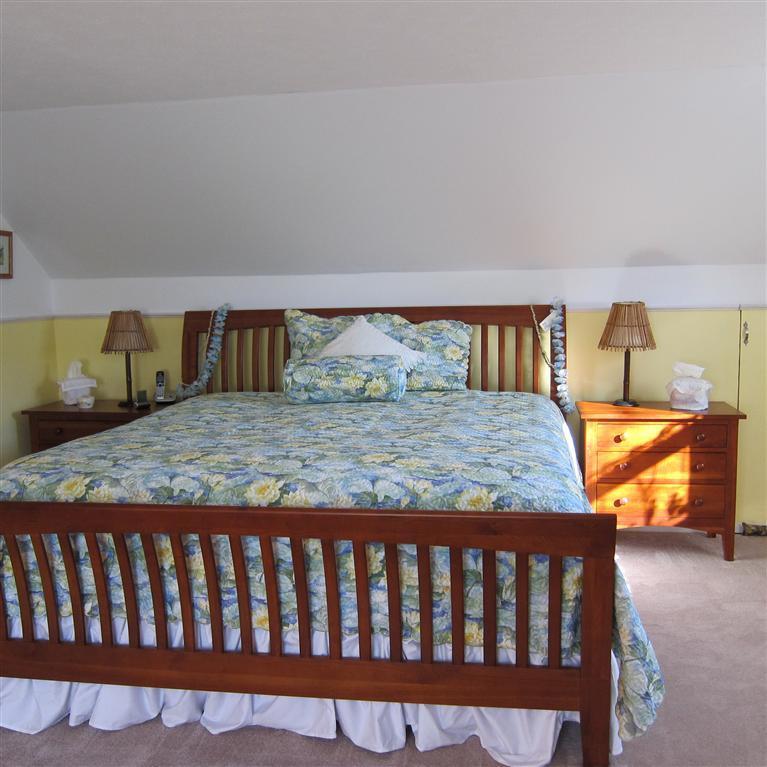 7 Oak Ridge Road East Falmouth, MA 02536 - Photo 5 of 13 a bedroom with a bed and wooden floor