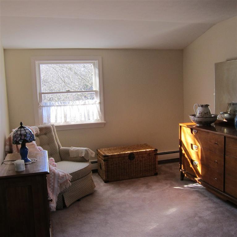 7 Oak Ridge Road East Falmouth, MA 02536 - Photo 8 of 13 a bed room with furniture and a window