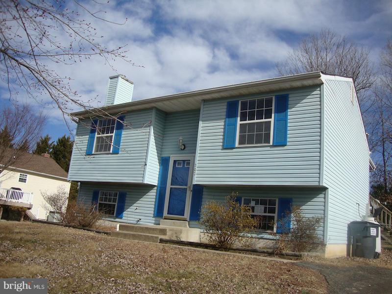 202 Choptank Road Stafford, VA 22556 - Photo 1 of 13 a front view of a house with a yard