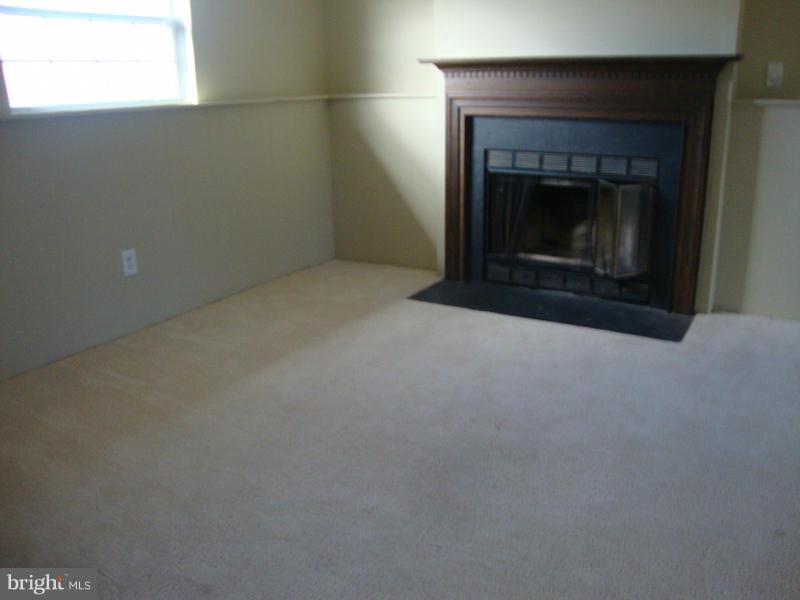 202 Choptank Road Stafford, VA 22556 - Photo 12 of 13 a view of empty room with a fireplace