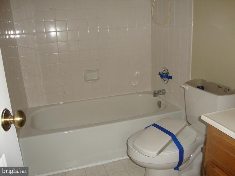 202 Choptank Road Stafford, VA 22556 - Photo 7 of 13 a bathroom with a sink a toilet and bathtub