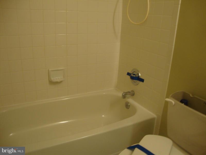 202 Choptank Road Stafford, VA 22556 - Photo 8 of 13 a white bath tub sitting next to a white toilet and a shower