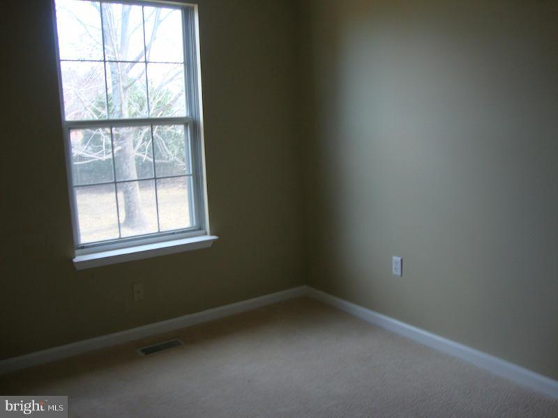 202 Choptank Road Stafford, VA 22556 - Photo 10 of 13 an empty room with a window