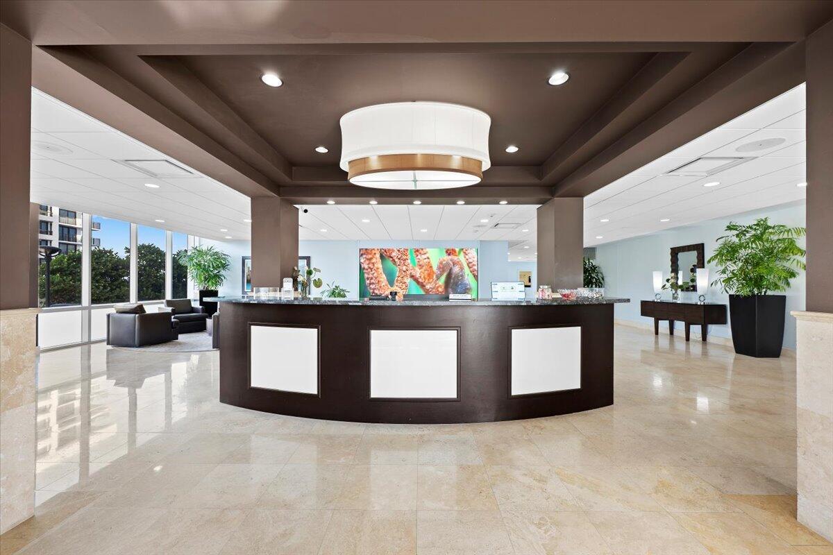 2000 South Ocean Boulevard, Unit 11D Boca Raton, FL 33432 - Photo 18 of 31 a view of kitchen with dining table and chairs
