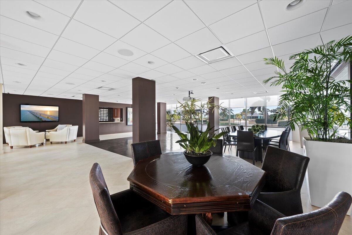 2000 South Ocean Boulevard, Unit 11D Boca Raton, FL 33432 - Photo 19 of 31 a dining room with furniture and a potted plant