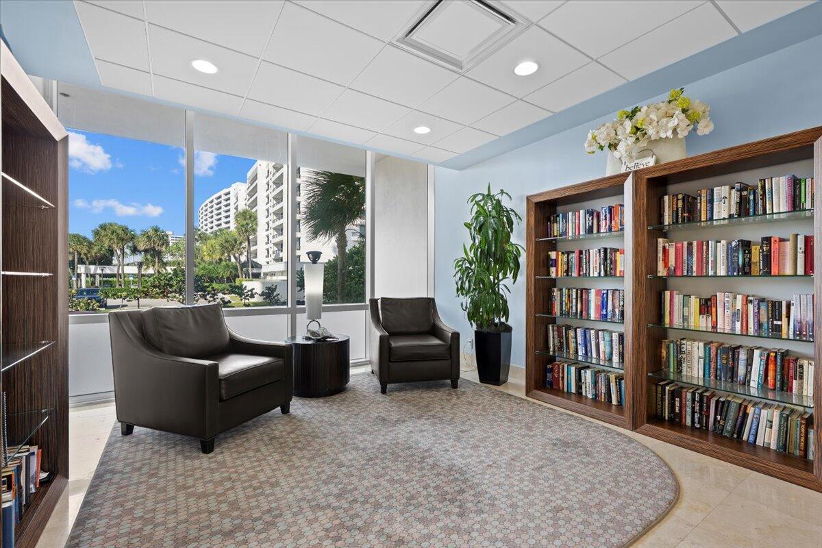 2000 South Ocean Boulevard, Unit 11D Boca Raton, FL 33432 - Photo 23 of 31 a living room with furniture and a book shelf