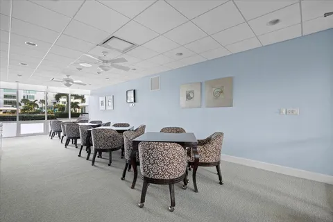 a living room with furniture and a book shelf