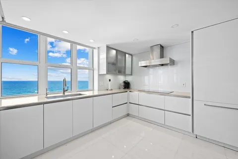 a kitchen with cabinets and window