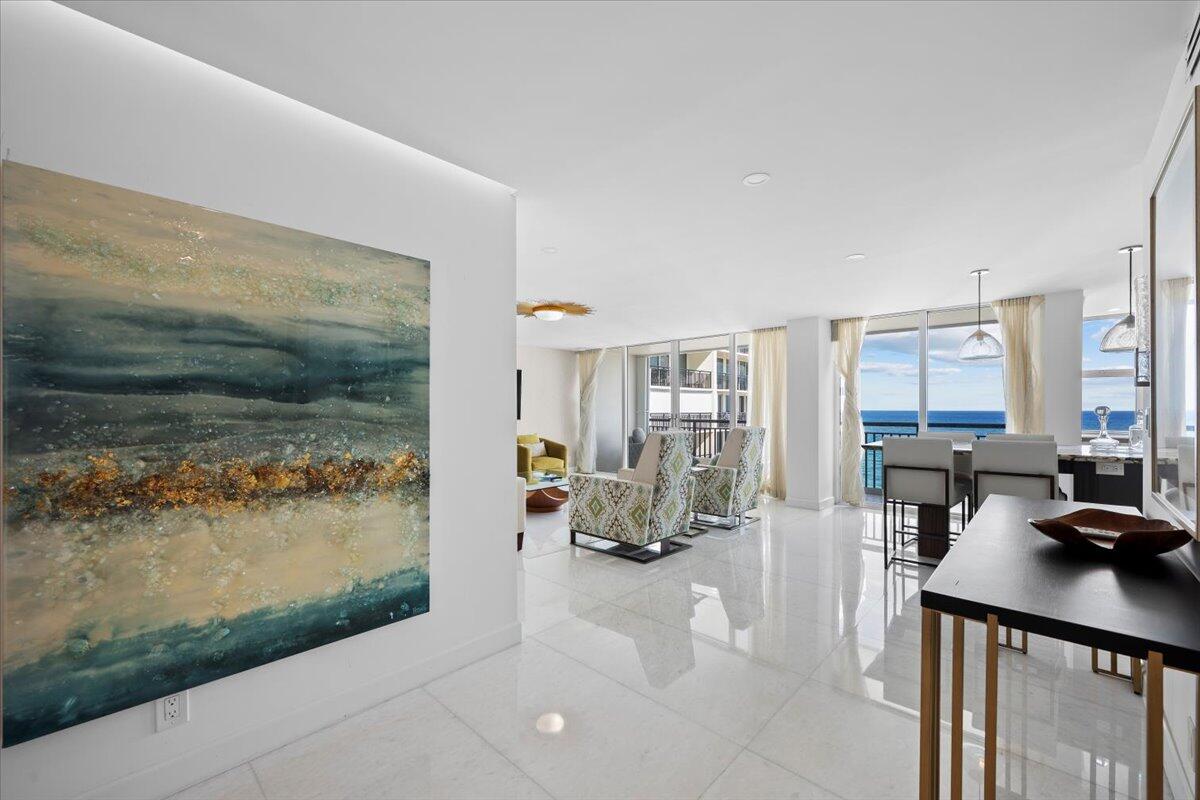 2000 South Ocean Boulevard, Unit 11D Boca Raton, FL 33432 - Photo 7 of 31 a view of living room filled with furniture and a floor to ceiling window