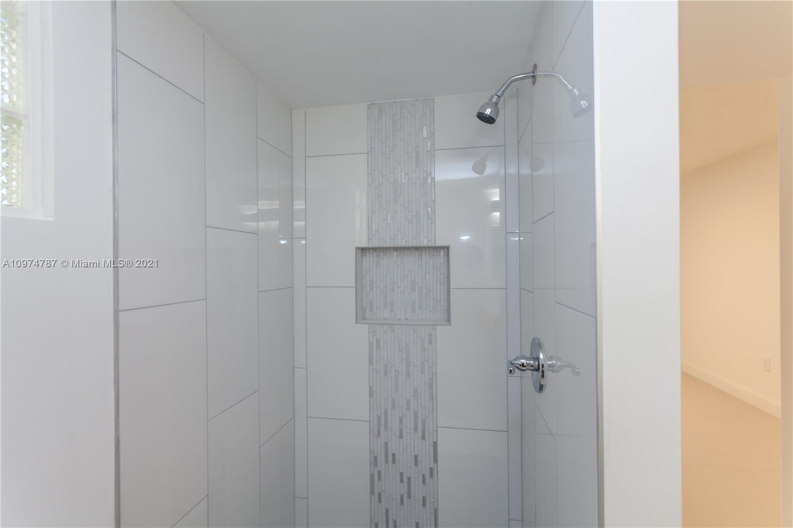 453 Town Road Southwest Palm Bay, FL 32908 - Photo 15 of 19 a bathroom with a shower