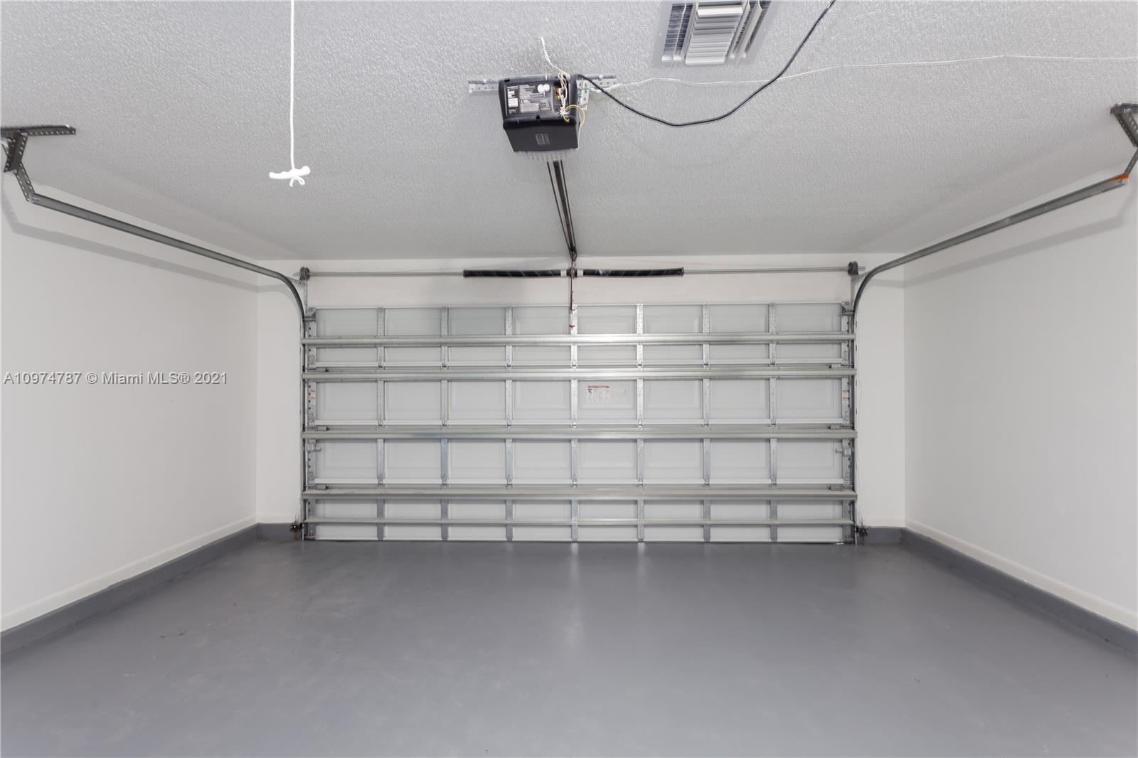 453 Town Road Southwest Palm Bay, FL 32908 - Photo 16 of 19 a view of a room with racks on the wall