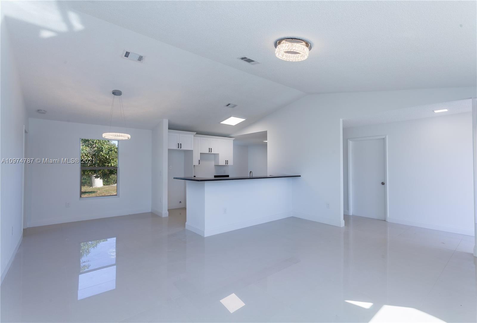 453 Town Road Southwest Palm Bay, FL 32908 - Photo 7 of 19 a view of kitchen and window