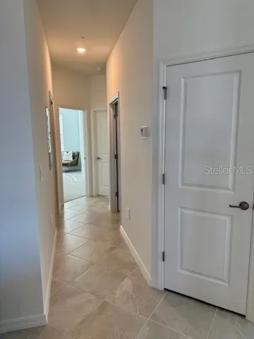 a view of a hallway with closet area