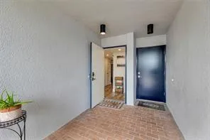 an empty room with closet and wooden floor
