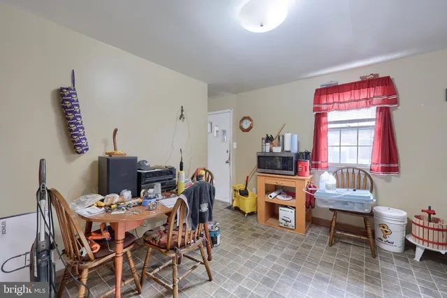 a dining room with furniture and window