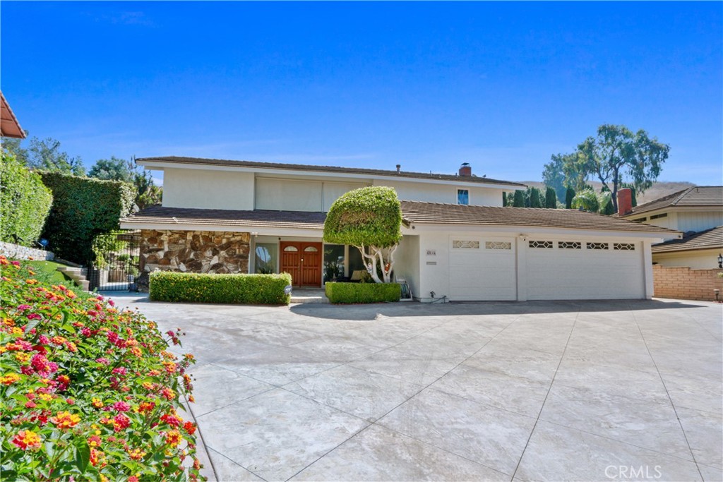 6046 Altmark Avenue Whittier, CA 90601 - Photo 1 of 27 a view of a garage with a table and a chair