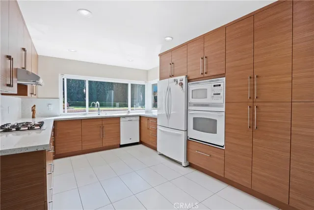 a kitchen with sink and window
