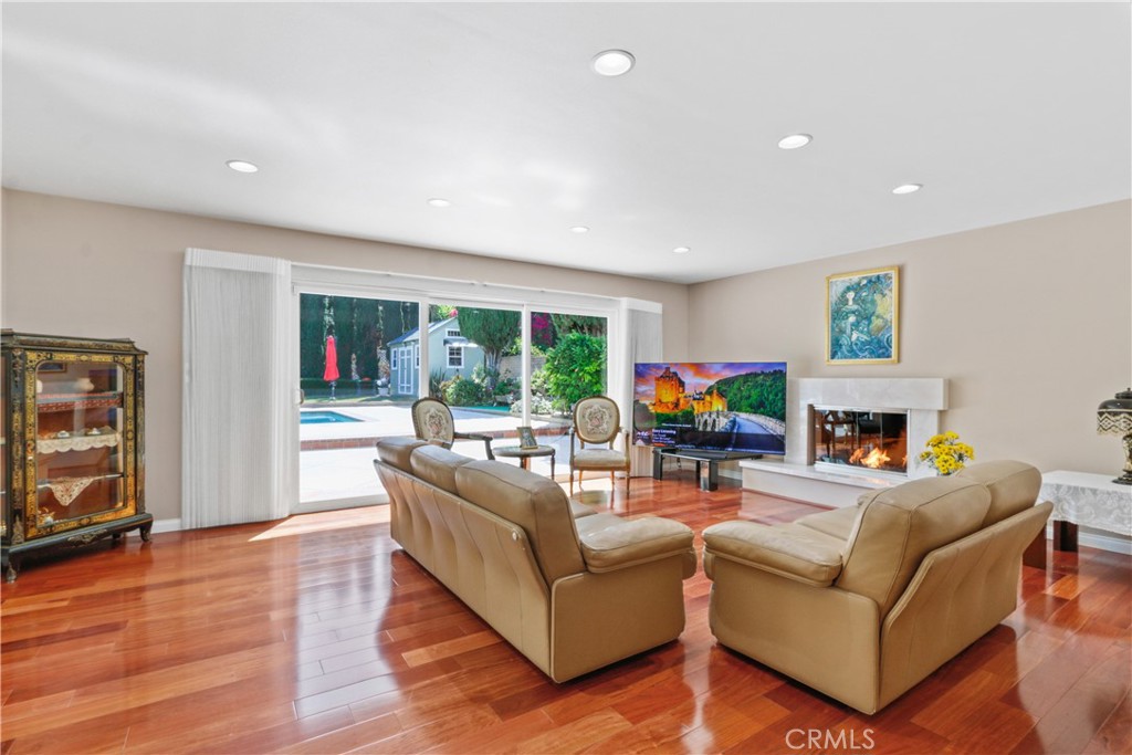 6046 Altmark Avenue Whittier, CA 90601 - Photo 17 of 27 a living room with fireplace furniture and a flat screen tv