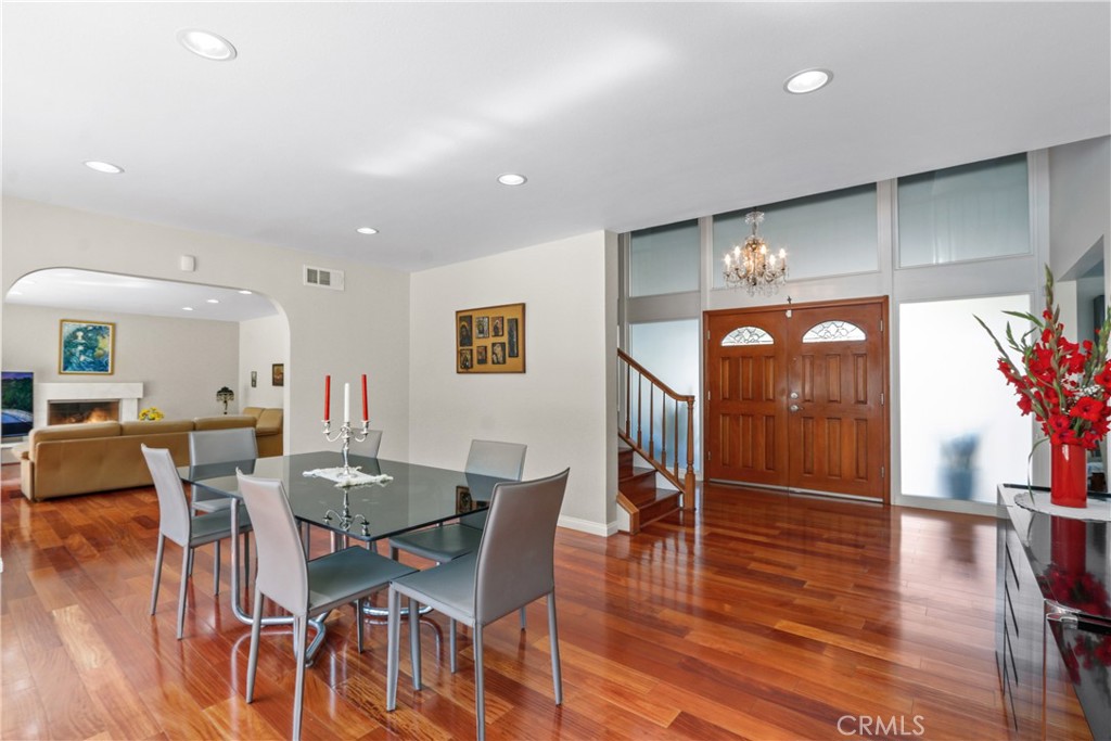 6046 Altmark Avenue Whittier, CA 90601 - Photo 18 of 27 a dining room with furniture entryway and wooden floor