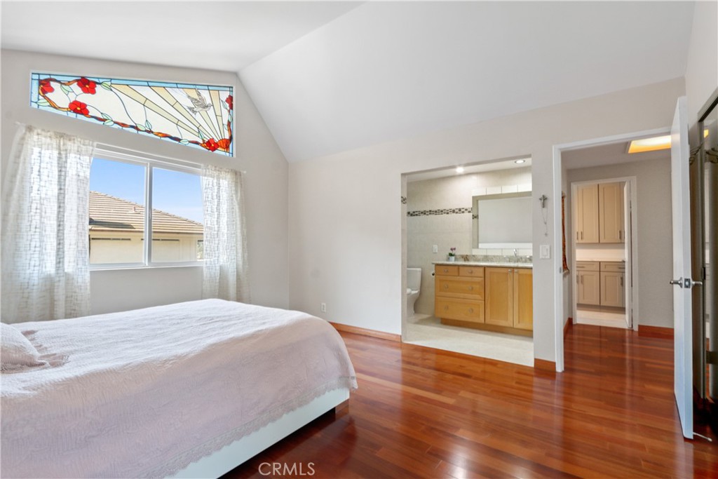 6046 Altmark Avenue Whittier, CA 90601 - Photo 21 of 27 a bedroom with a bed and a window