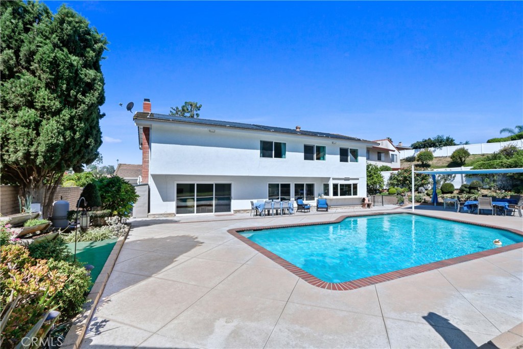 6046 Altmark Avenue Whittier, CA 90601 - Photo 24 of 27 a view of a swimming pool with a patio