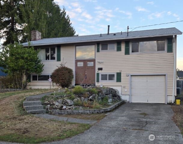 4316 Northeast 10th Street Renton, WA 98059 - Photo 1 of 25 a view of a house with a yard