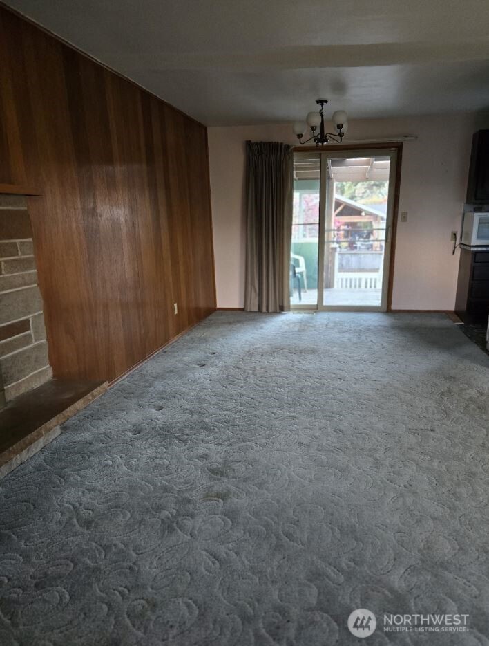 4316 Northeast 10th Street Renton, WA 98059 - Photo 4 of 25 a view of an empty room with a window