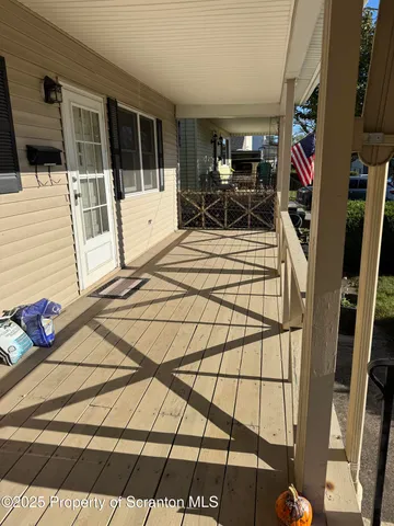 a view of a balcony with chairs