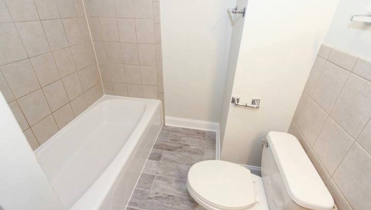 677 South River Road, Unit 2H Des Plaines, IL 60016 - Photo 12 of 15 a bathroom with a sink and toilet